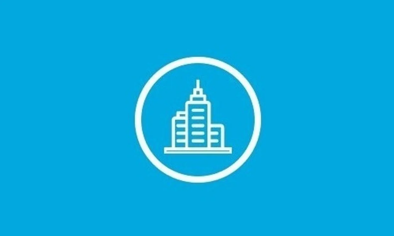A white building icon inside a circle on blue.
