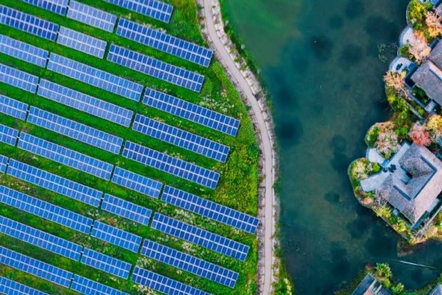 Solar-panels-with-buildings-on-water.jpg