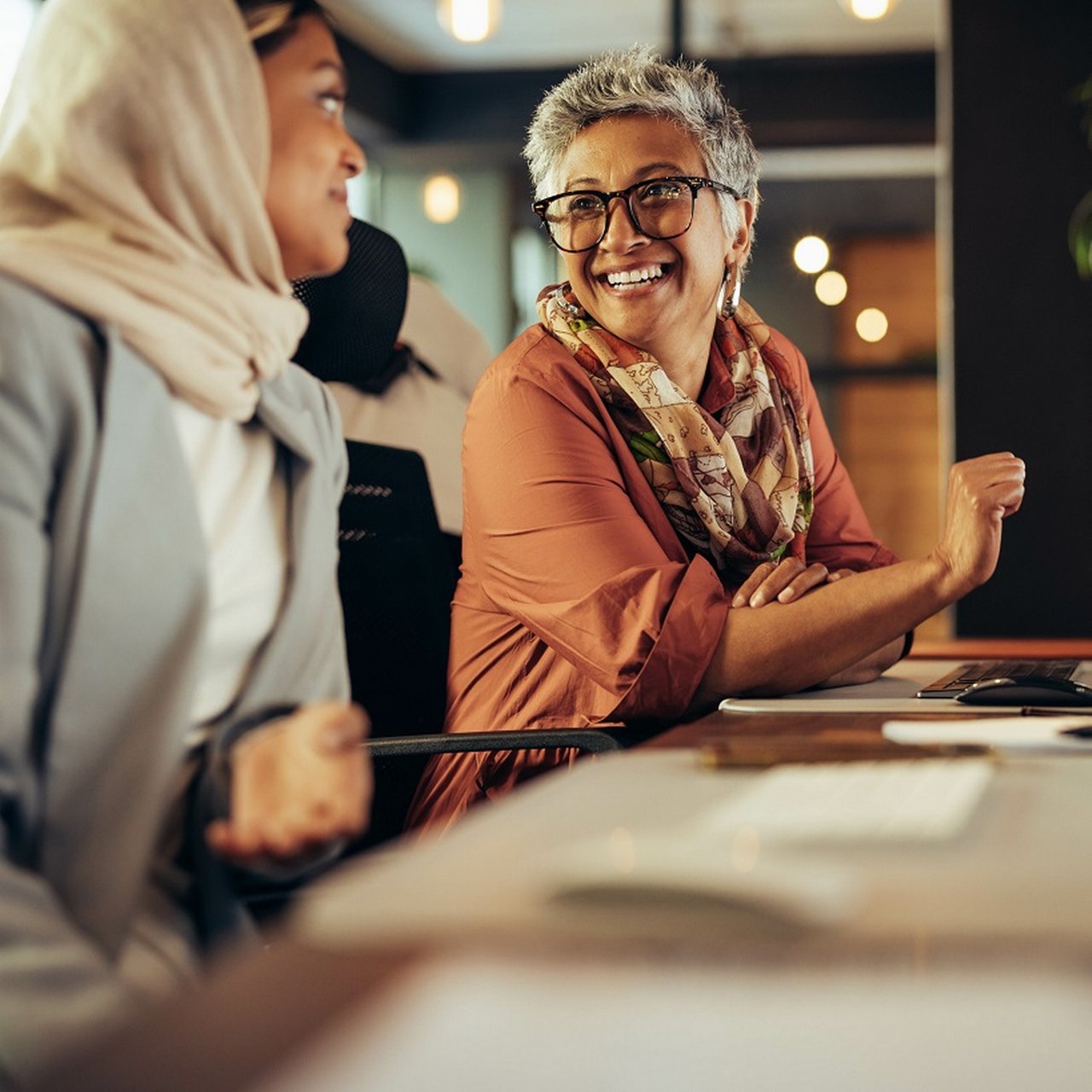 Two female employees laughing
