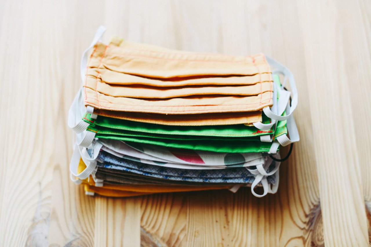 On the photo are fabric masks, which are lying on the table.