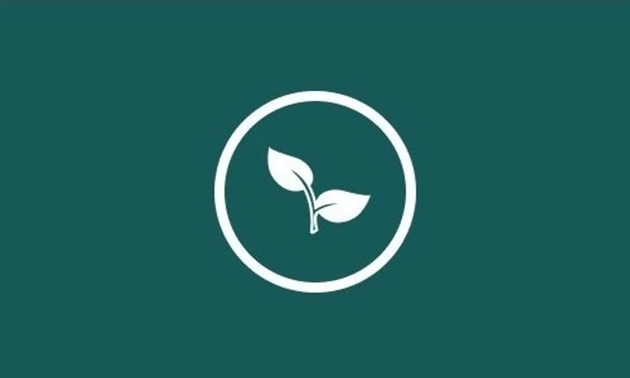 A white leaf icon inside a circle on green.