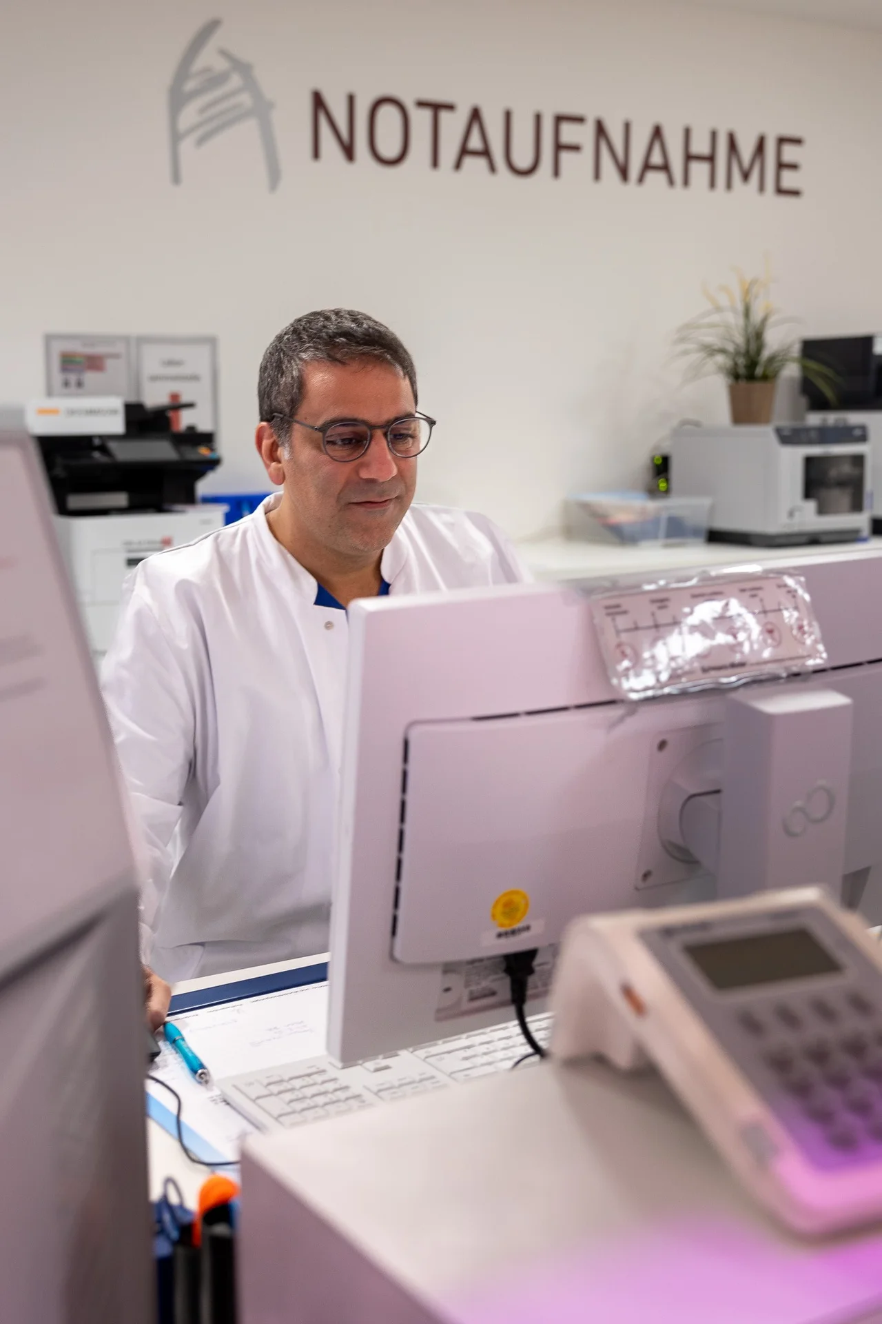 Mogharrebi working at desk