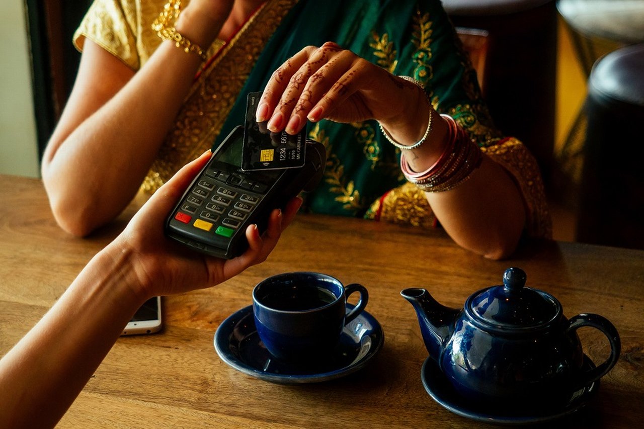 Woman paying with credit card