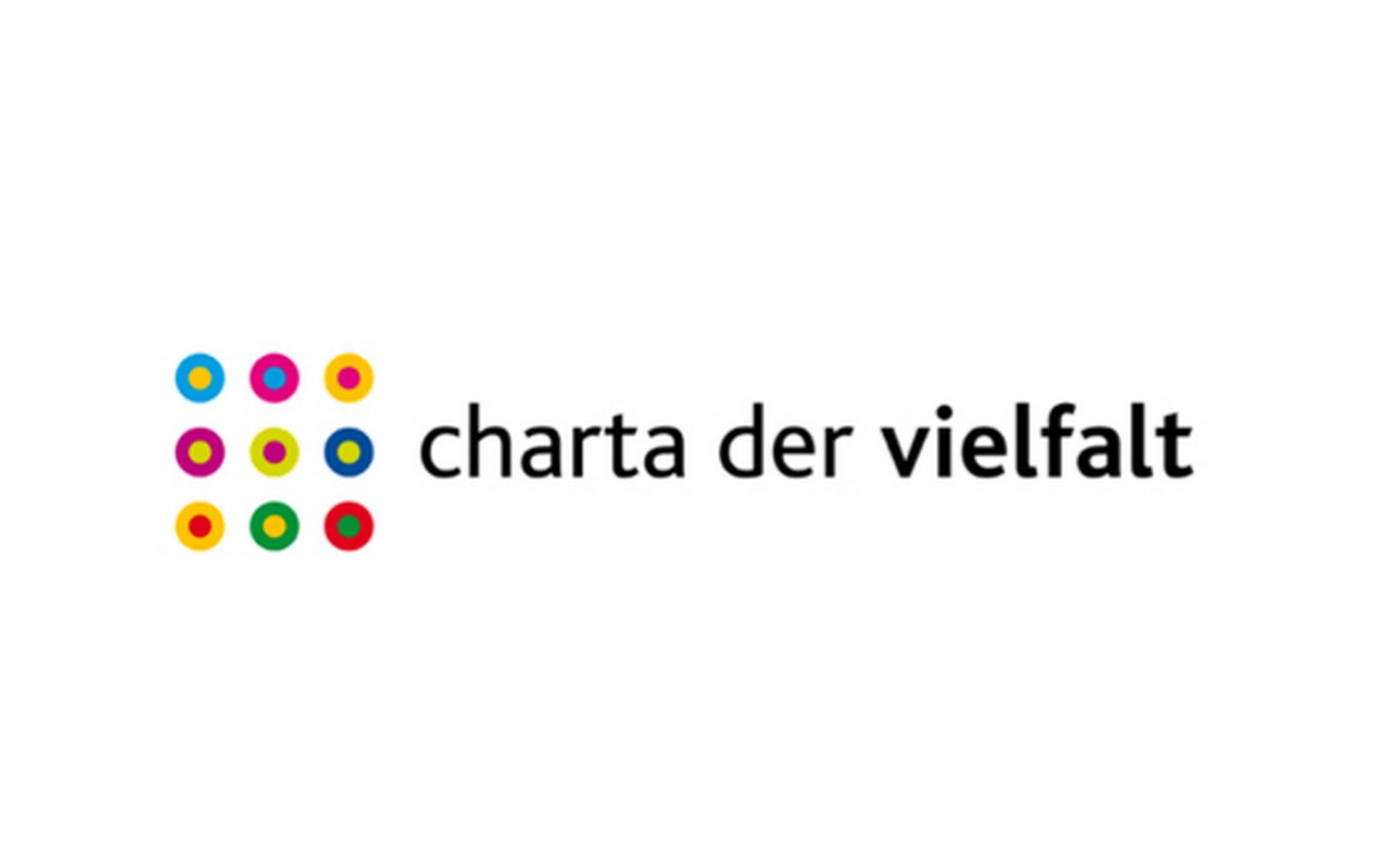 Logo in the form of nine colored balls in a square, next to which is written: ${esc.q}Charta der Vielfalt${esc.q}.