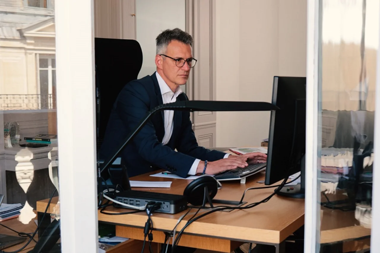 Olivier at his desk