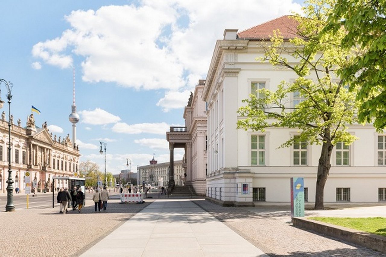 View of Berlin's Unter den Linden with PalaisPopulaire in the foreground and TV tower in the background