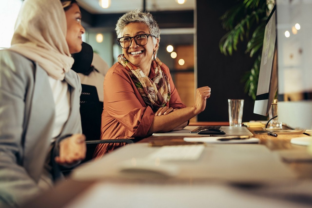 Two female employees in discussions