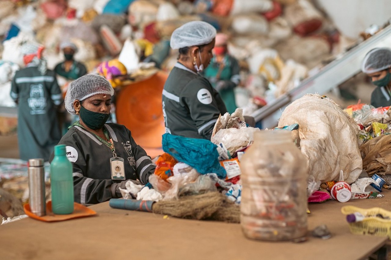 CleanHub boy sorting plastic waste in Kerala