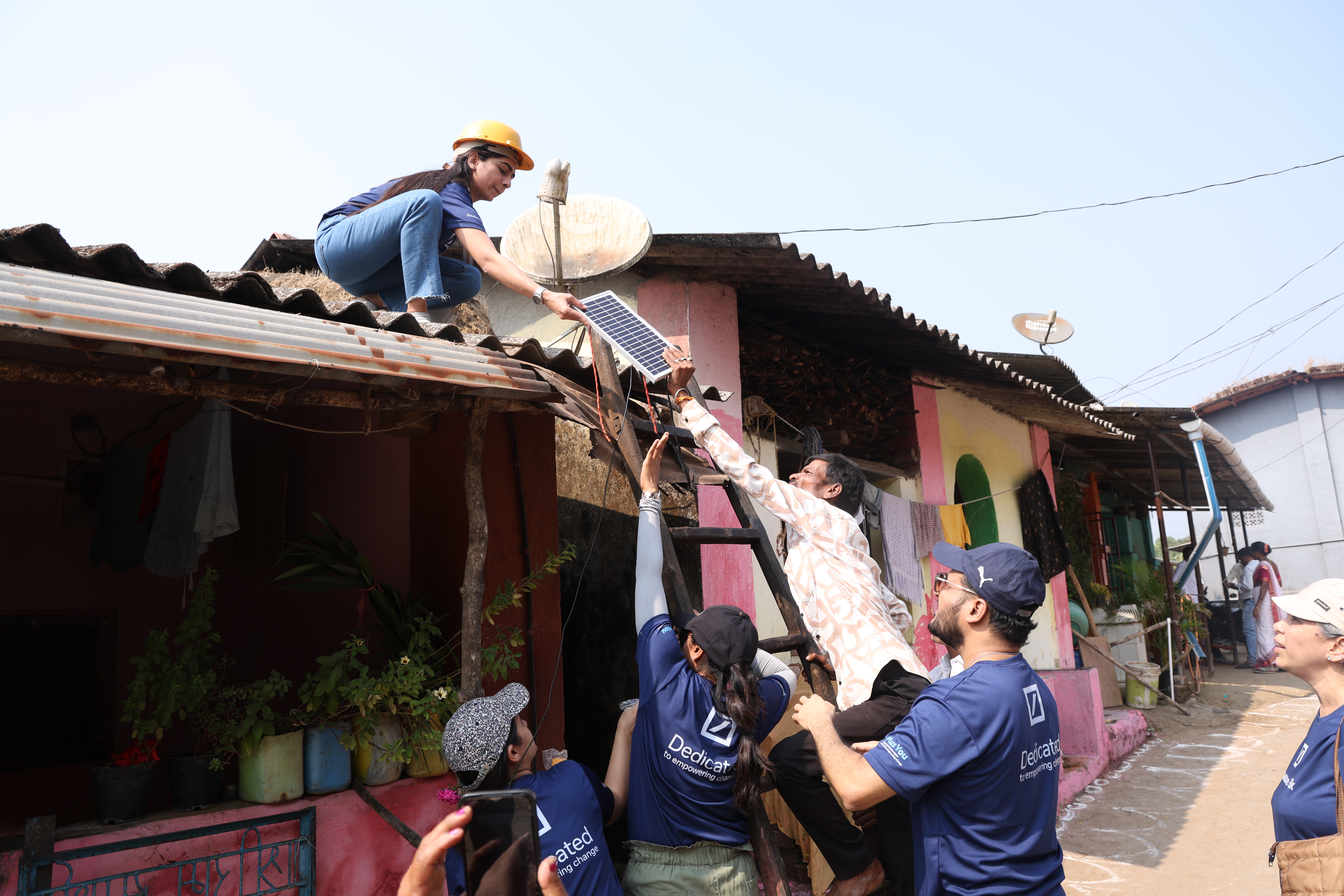 Installing a solar panel on a house roof
