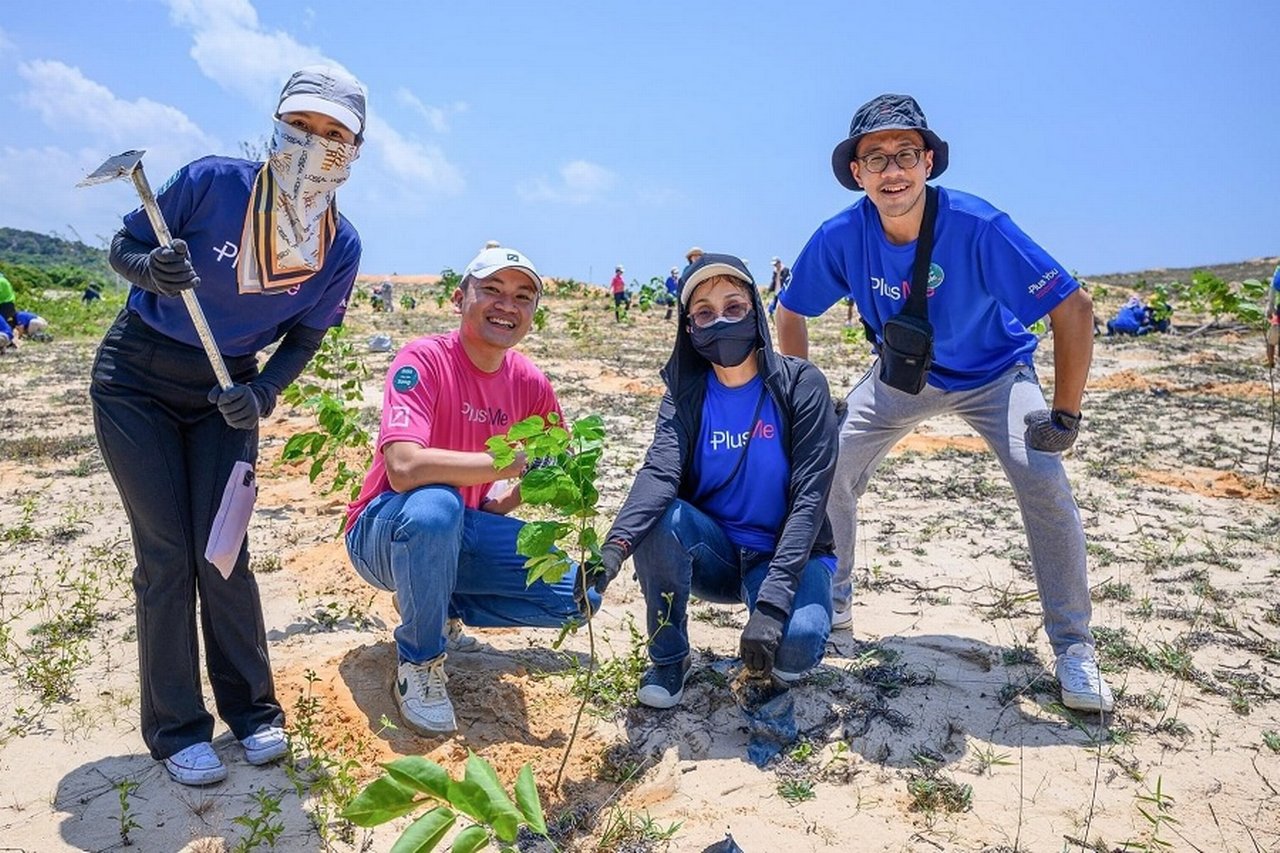 Volunteers planting trees at Gaia Nature Conservation in Vietnam