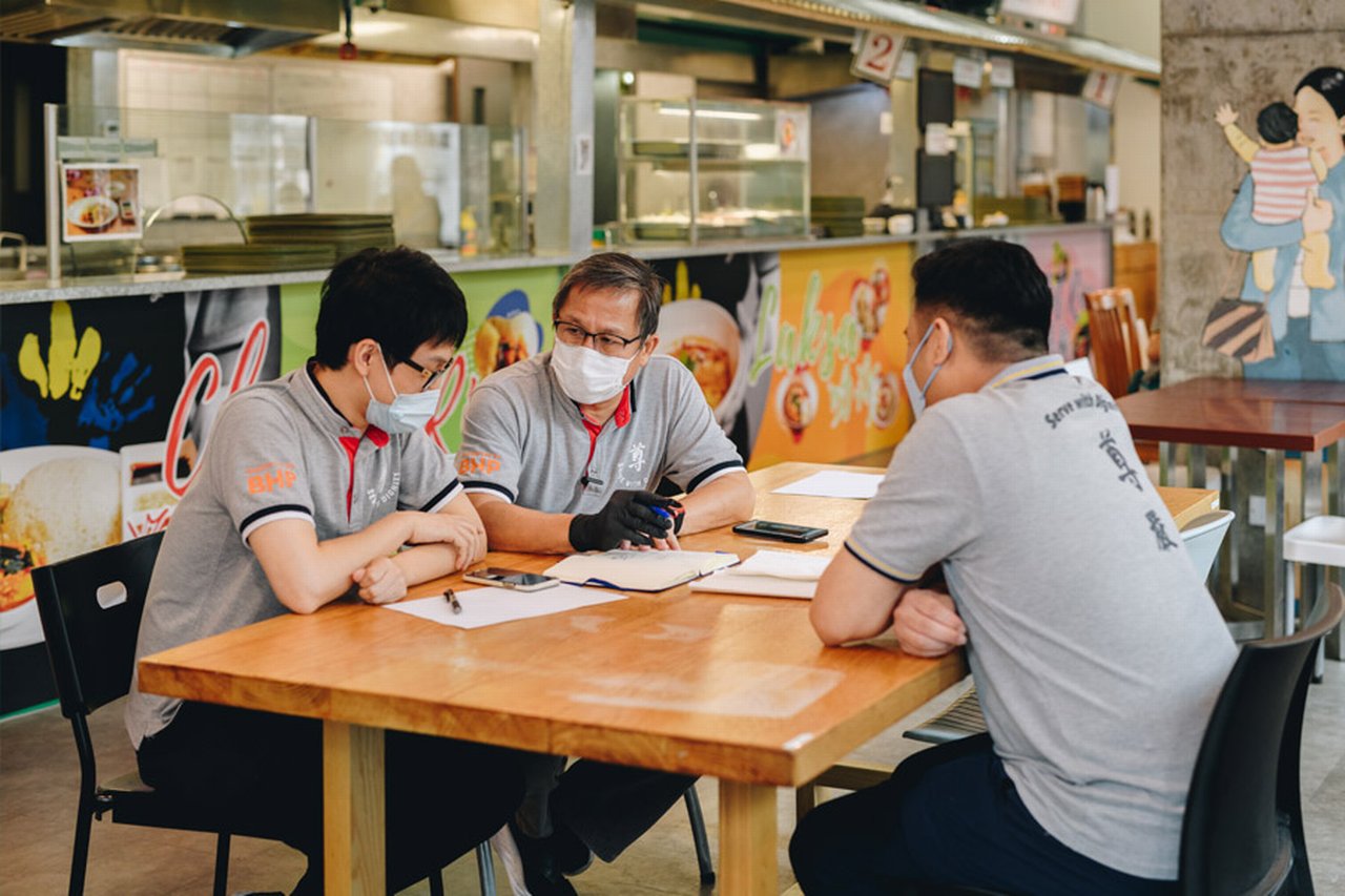 Koh Seng Choon reading the books