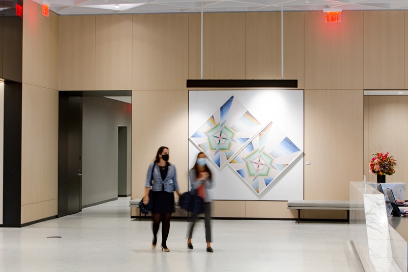Two-women-walking-modern-lobby.jpg