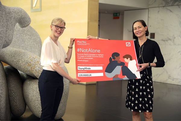 Tiina Lee hands over cheque to YoungMinds