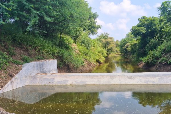 Cement nala bunds in India to capture rainwater and enhance groundwater recharge