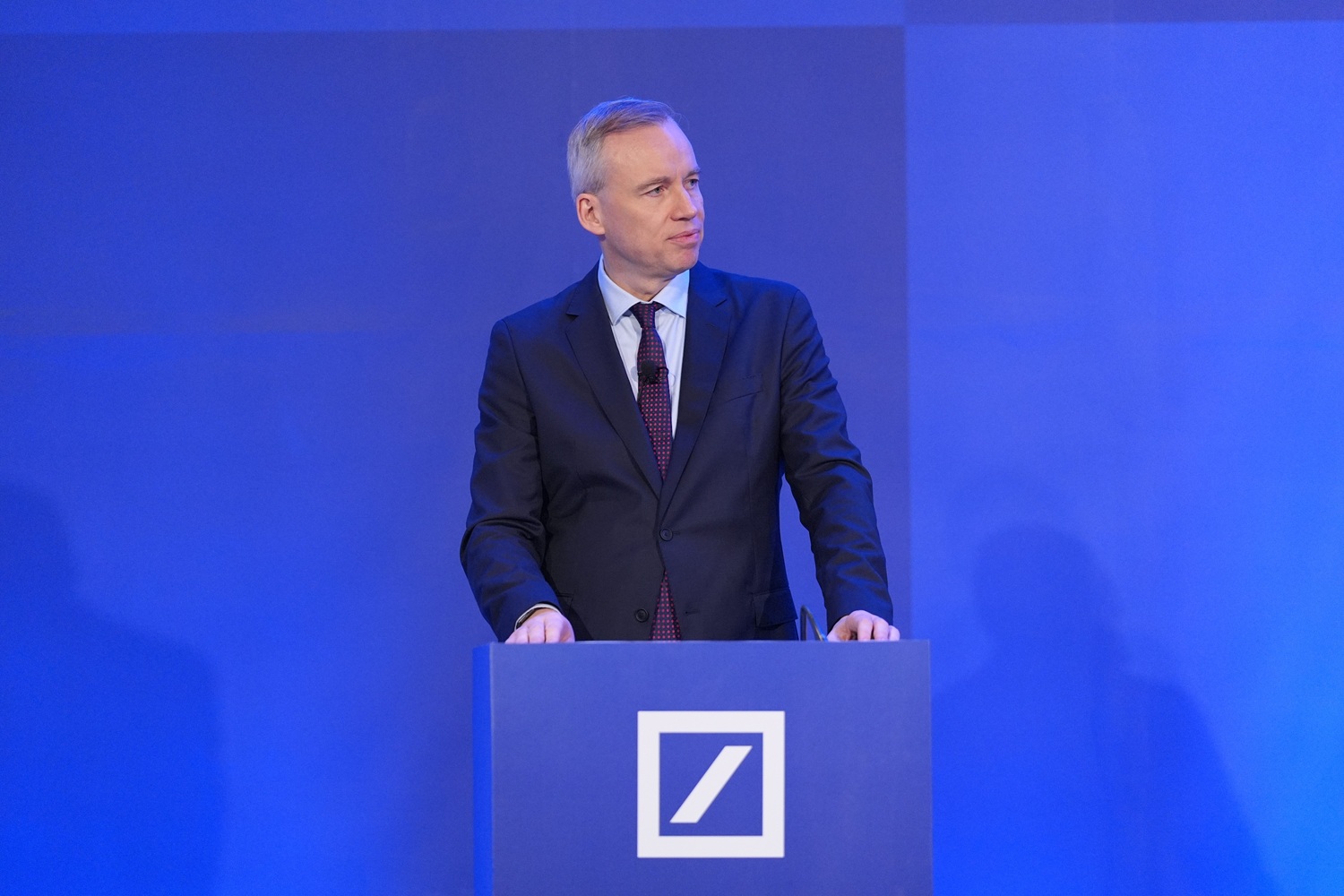 Alexander von zur Muehlen speaking at lectern