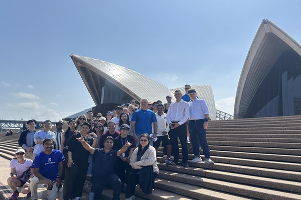 A team of Deutsche Bank colleagues gather at the Sydney Opera House.