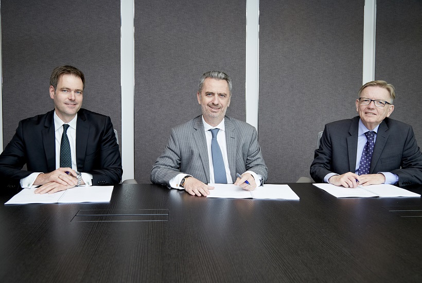 At the signing in London (l-r): Michael Hoelter and Nicolas Moreau (Deutsche AM), together with Howard Bamsey (GCF)